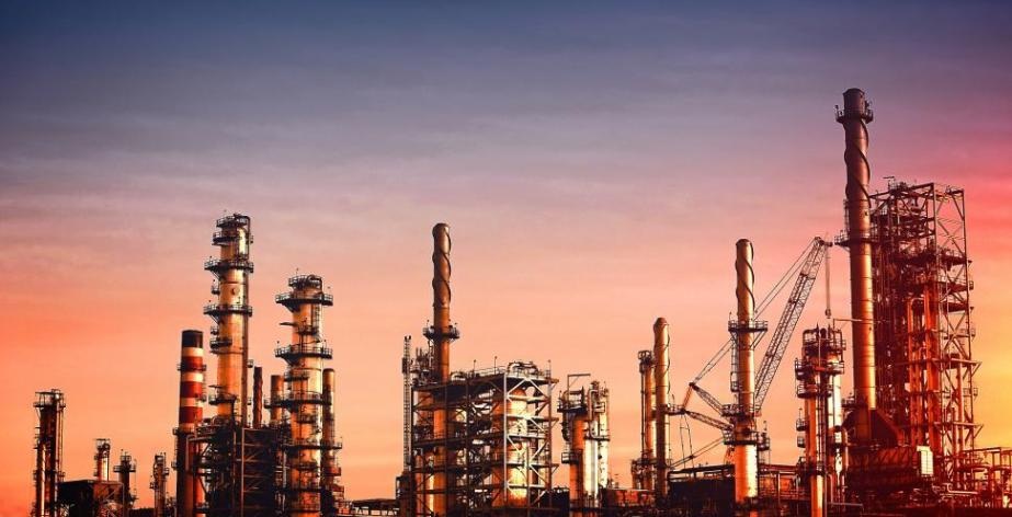 oil refinery at dusk vivid colors